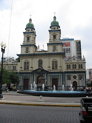 Church of San Francisco with two towers and 
       a fountain in front of it