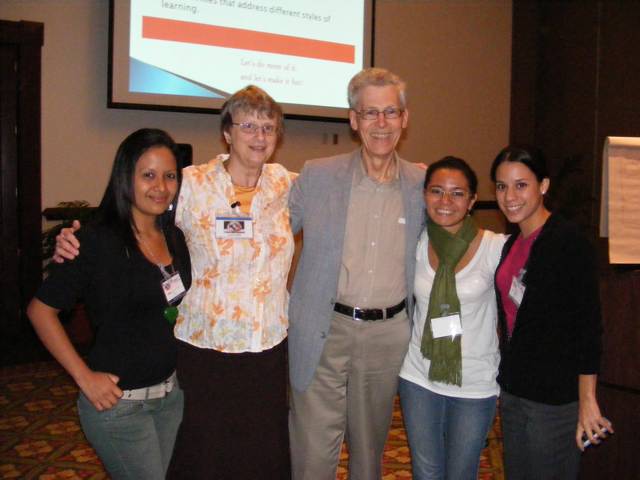 Three female students have their photo taken
                    after the workshop with Gail and Al