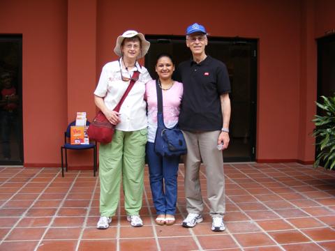 Gail, Catherina, and Al standing in front
                of the little museum at the site