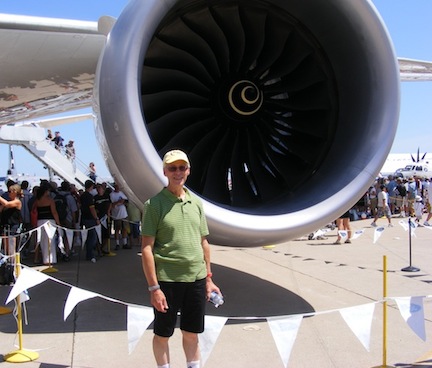 Al is dwarfed by the large air intake behind him.