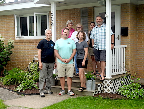 We are standing on Ruth Ann’s front porch