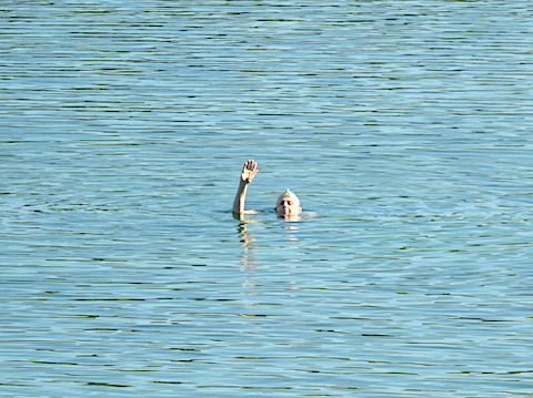 Gail is  surrounded by only water and waving