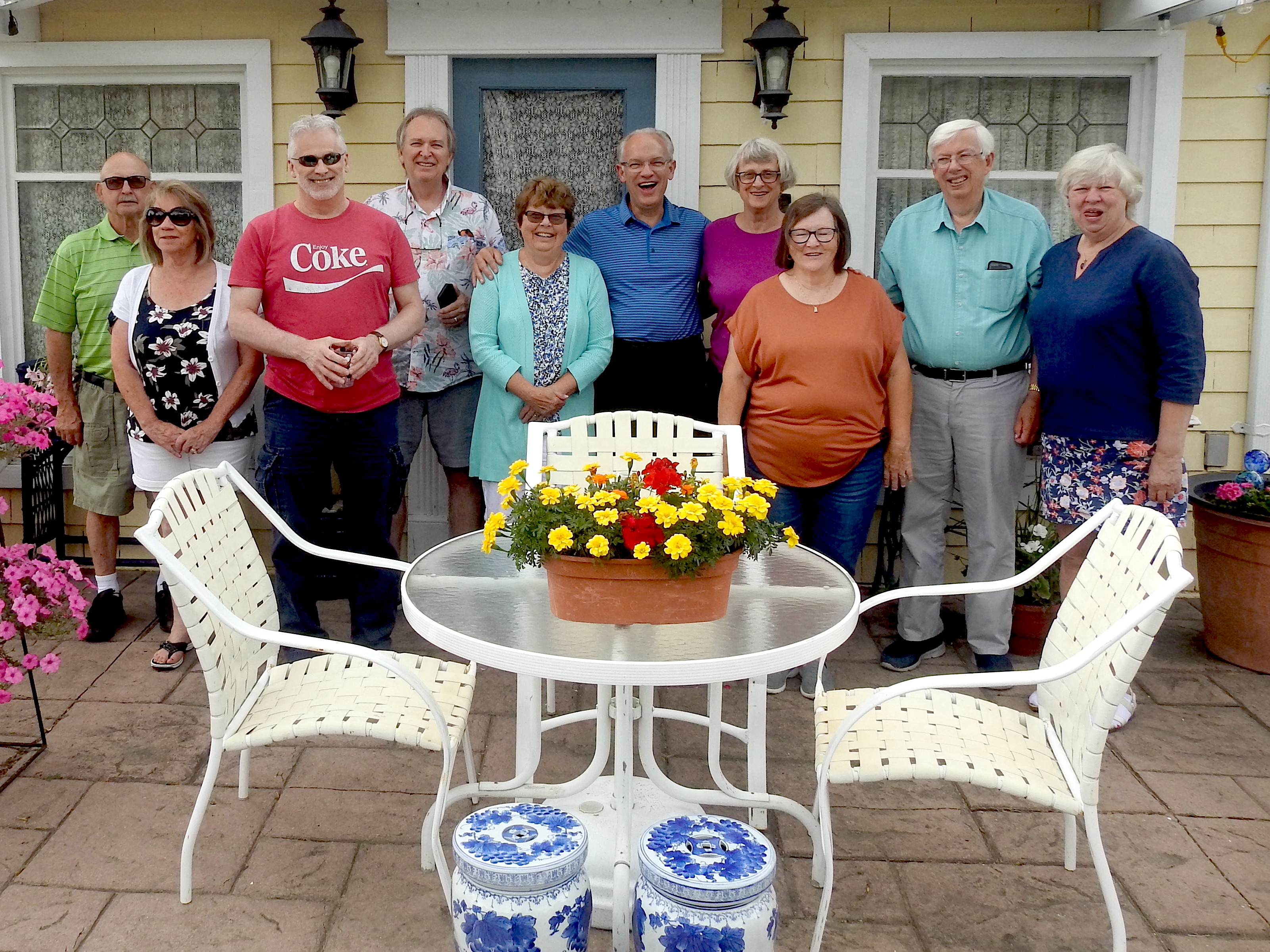 Descendents and guests are standing in front of Mark’s little house, 
           a converted garage where some of his antiques aredisplayed