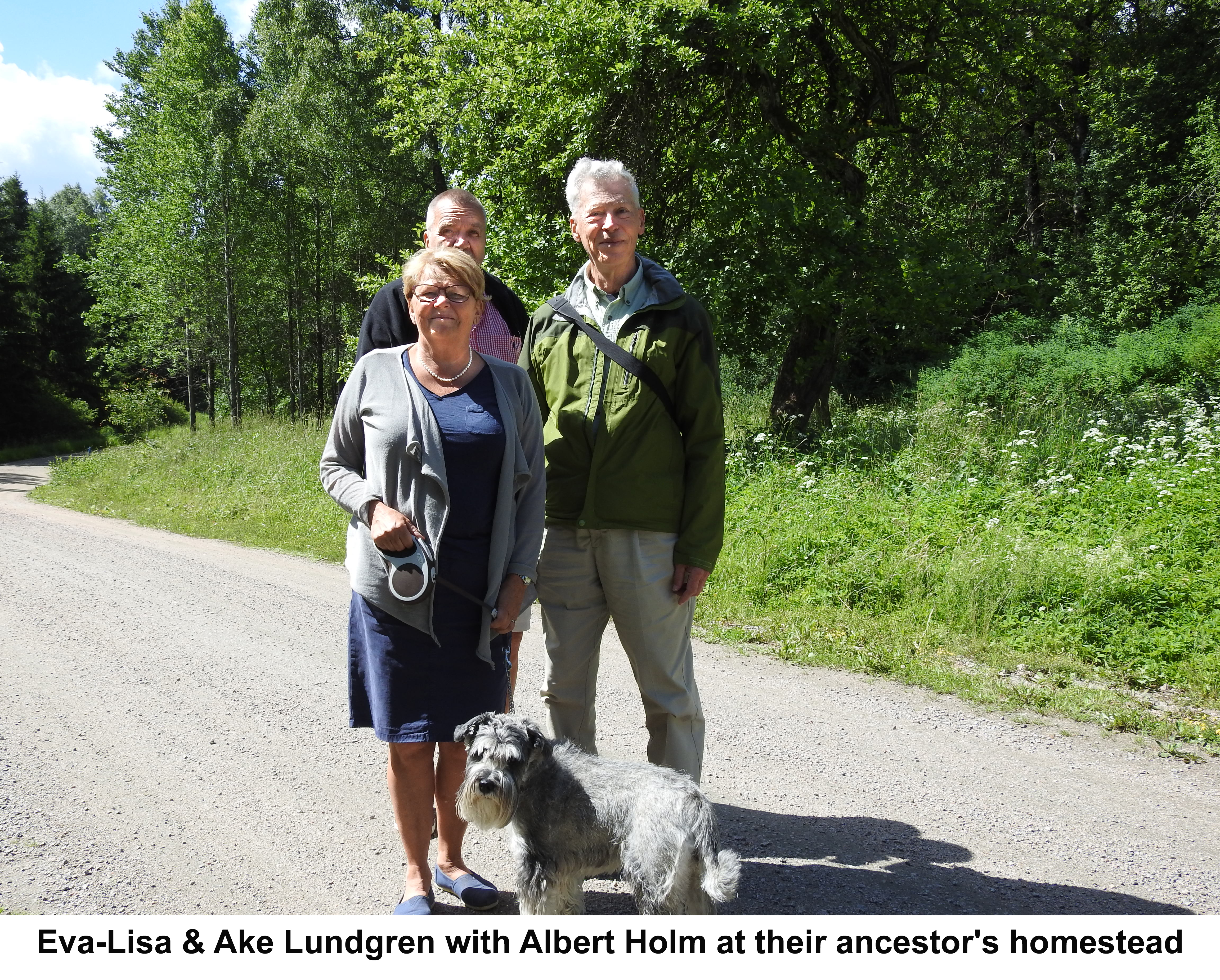 Eva-Lisa and Ake Lundgren and Albert Holm standing in front of trees 