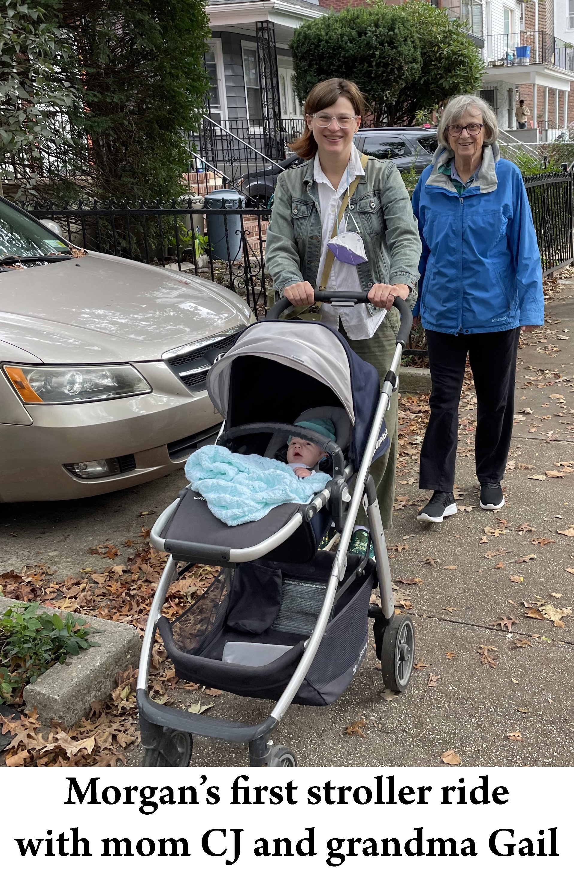 CJ is pushing Morgan’s stroller on a sidewalk with Morgan
               in the stroller and Gail is walking beside