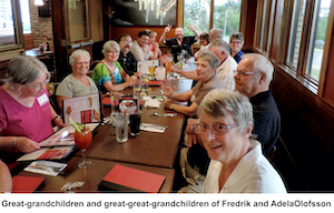 Everyone sitting at a long table