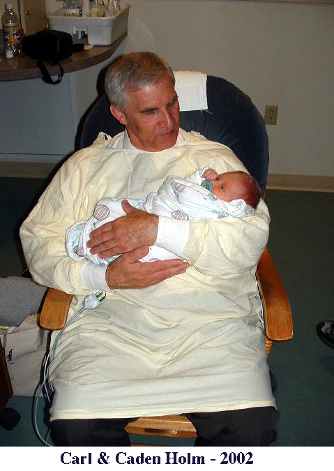 Carl Holm with his first grandchild, Chris Holm's son Caden, in 2002