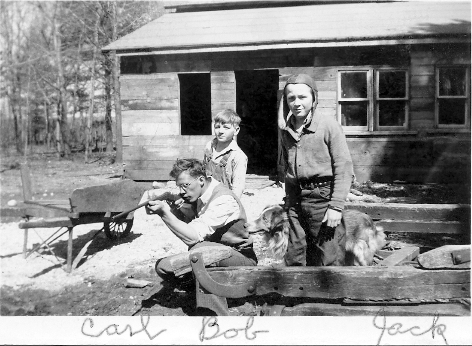 Carl is kneeling and point a small rifle to the left