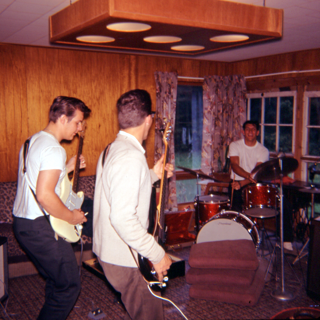 The Excels's Carl Holm, Clark Sullivan and, I think, John
      Zelinski rehearsing in our living room in Bates Township