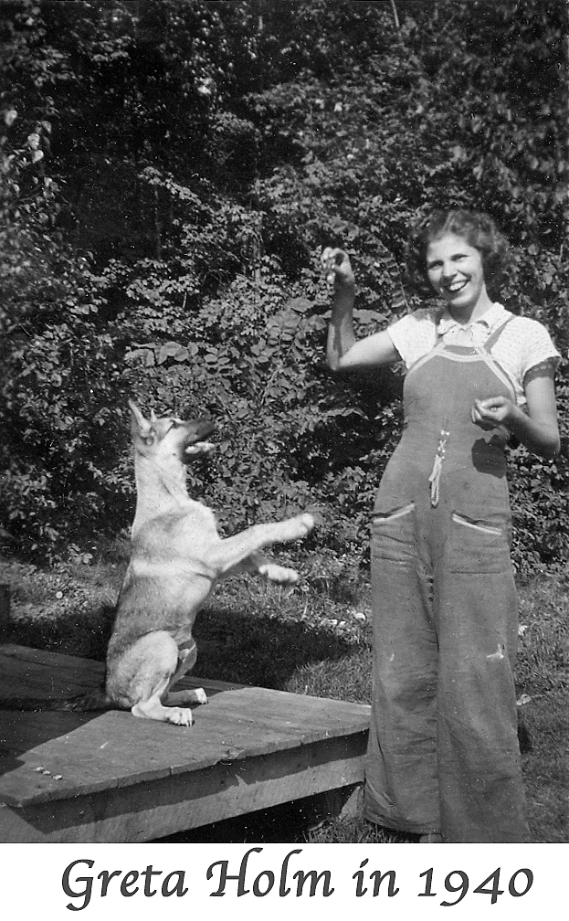 Greta Holm holding a treat for the German Shepard Lucky