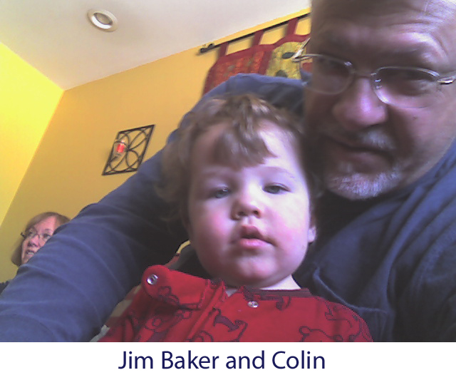 Photograph of Jim Baker holding his grandson, Colin
