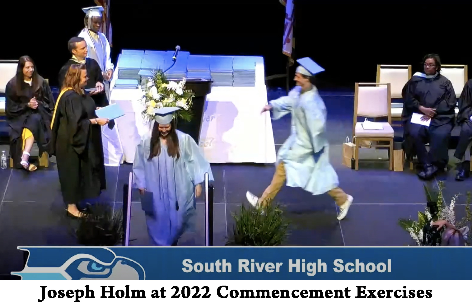 Joseph Holm bounces across the stage at his graduation