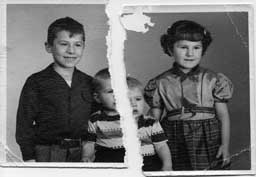 A studio photograph of the Baker children - torn in half