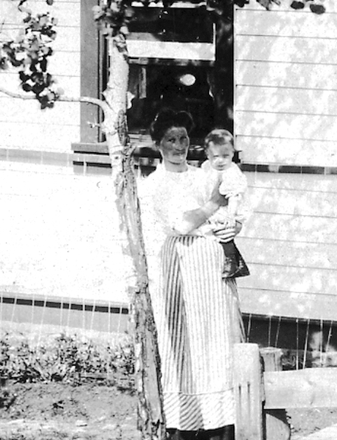 Probably Anna Carlson holding with her daughter Dagmar.