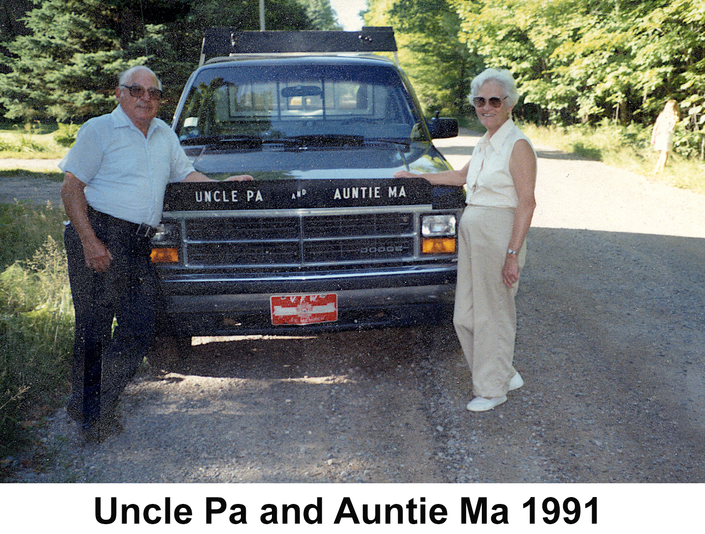 Murray and Helen Baker standing by their camping truck in 1991