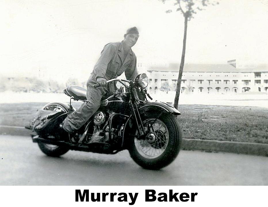 Murray Baker in uniform standing astride a powerful motorcycle