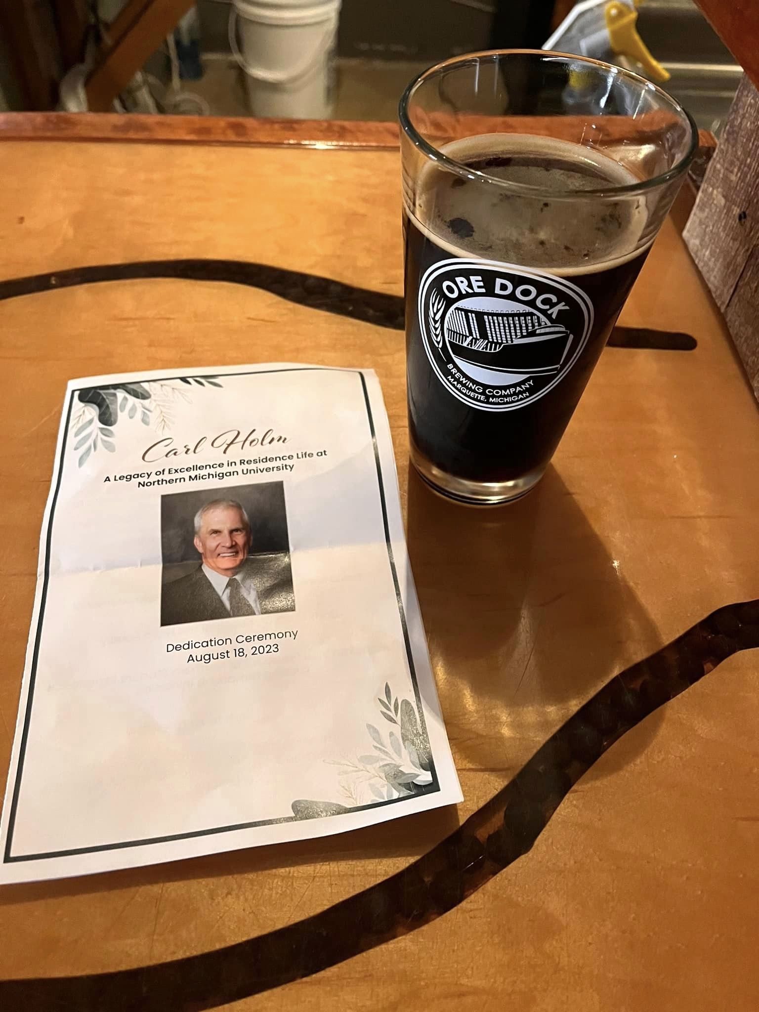 A glass of beer and the program cover 