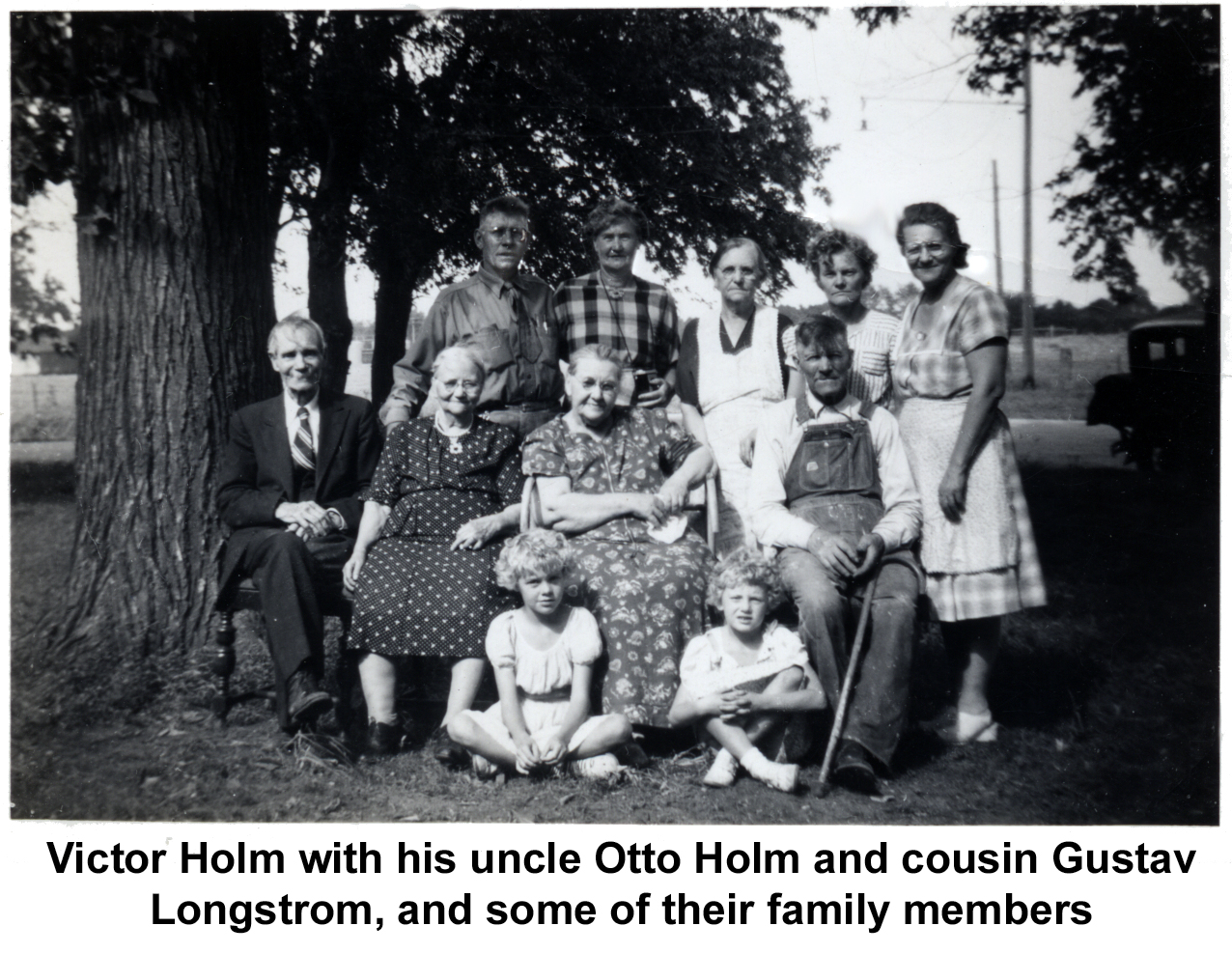 Victor and Jenny Holm having their photo
       taken with Victor's relatives from Tracyn Minnesota.