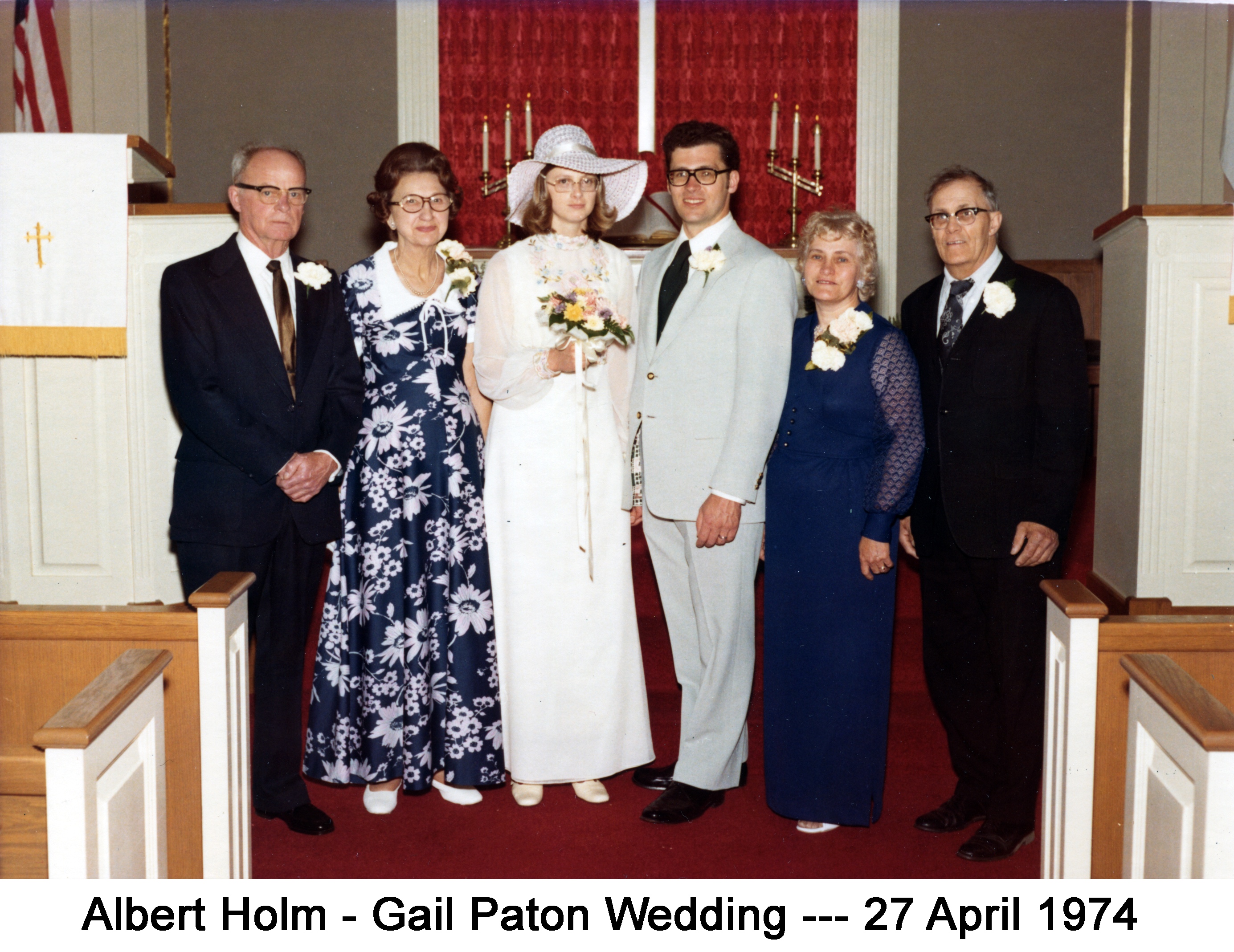 Wedding photo of Gail Paton and Albert Holm standing at the altar, flanked by their parents
