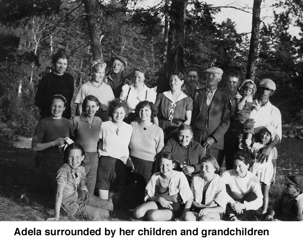 Adela Olafsson surrounded by her children and grandchildren
