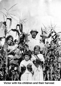 Victor and children with harvest