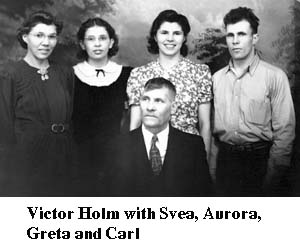 Victor Holm and his children in a studio photograph