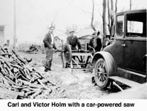 Carl and Victor Holm sawing firewood