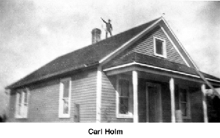 Carl Holm standing on a roof