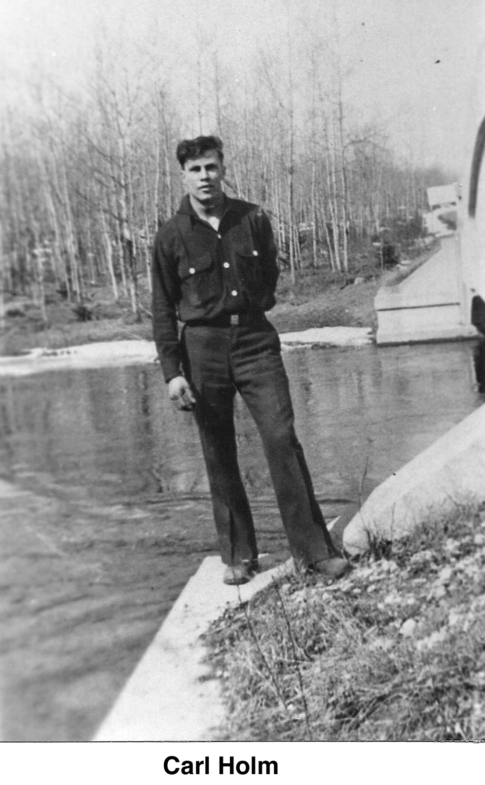 Carl Holm standing near a bridge
