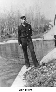 Carl Holm standing near a bridge