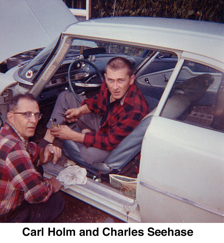 Carl Holm and Charles Seehase working on Charles's car