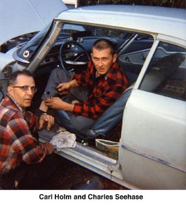 Carl Holm and Charles Seehase working on Charles's car