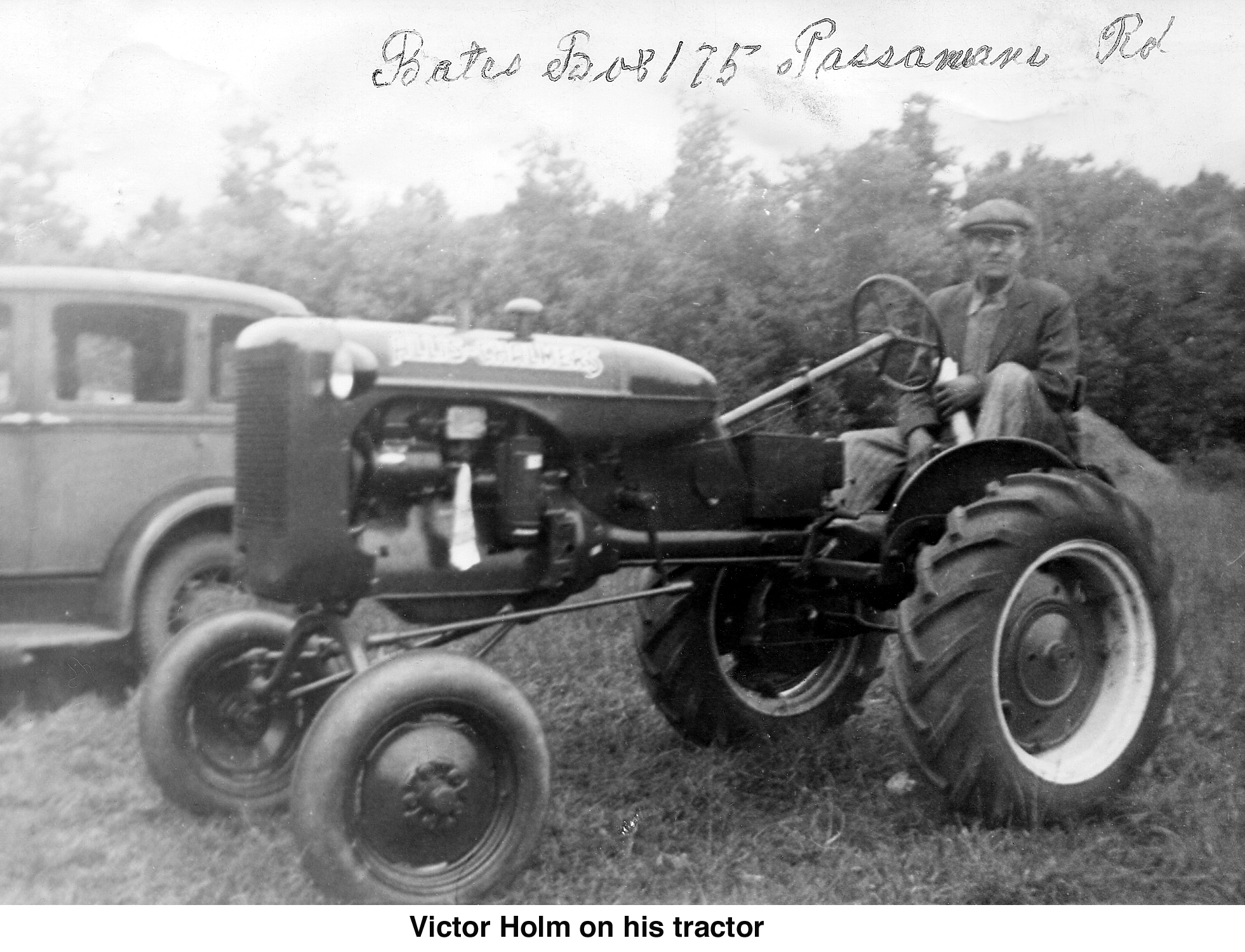 Victor Holm seated at the wheel of his tractor