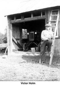 Victor Holm in front of his barn/garage