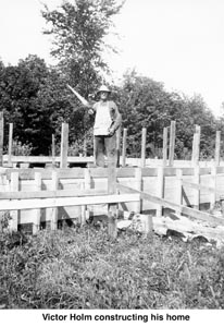 Victor Holm constructing his home
