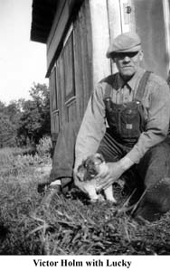 Victor Holm holding the puppy Lucky