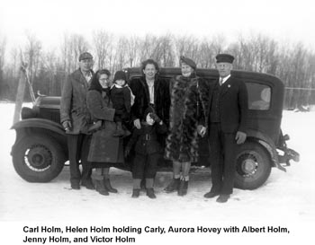 Carl and Victor Holm with their families in the snow