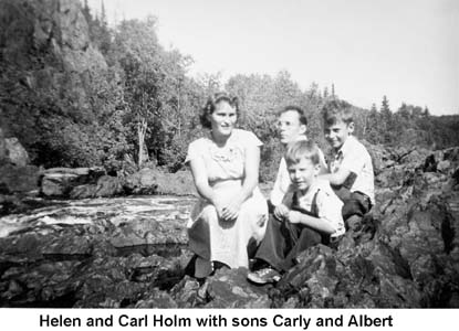 Carl and Helen Holm with Carly and Albert by a rapids