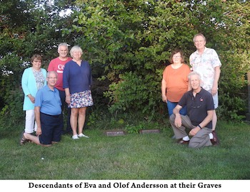 The great-great-grandchildren of Olof and Andersson are on each side           of their graves