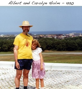 Al and Carolyn Holm hugging at the Wright memorial in Kill Devil Hills, N.C.