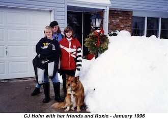 CJ, her friends, and Roxie are in our driveway next to a huge pile of snow