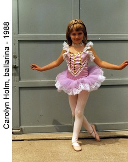 Carolyn Holm posing in her ballarina costume in front of our garage doors