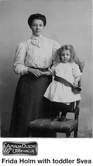 Frida Holm and daughter Svea is seen in a Swedish studio photo.