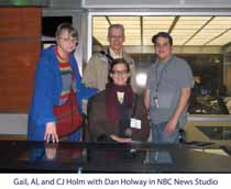 Dan Haloway and Gail, CJ, and Al Holm standing in the NBC Evening News Studio