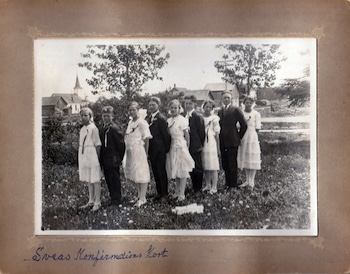 Svea and 8 other members of her confirmation class standing in a field