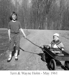 Terri with Wayne in a wagon in the front yard