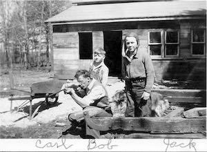 Carl is kneeling and point a small rifle to the left