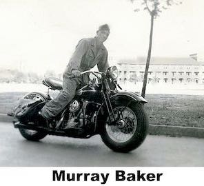 Murray Baker in uniform standing astride a powerful motorcycle
