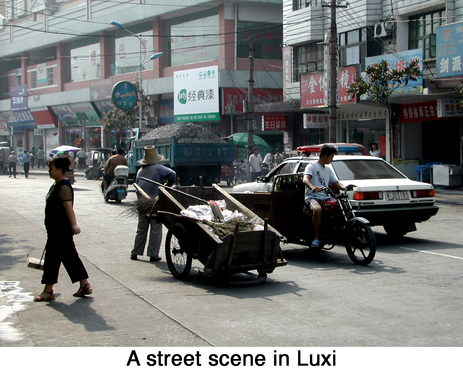 A street crowded with assorted vehicles