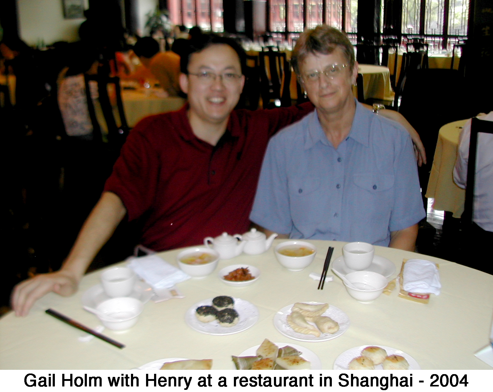 Henry with Gail Holm in a restaurant in Shanghai